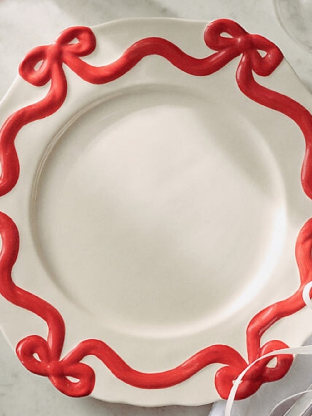 Anthropologie Cream Dinner Plate with Red Ribbon Border